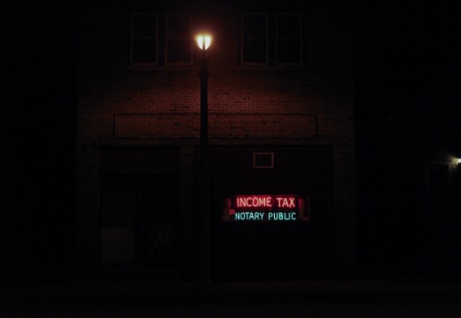 neon sign that says income tax