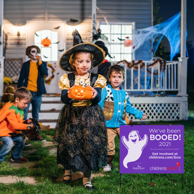 Young children dressed up for Halloween trick-or-treating