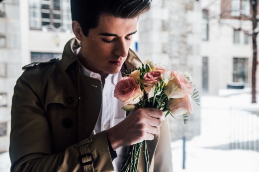 Man holding pink roses