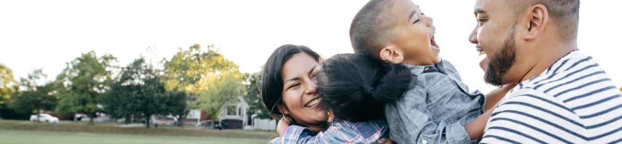 Family hugging and laughing