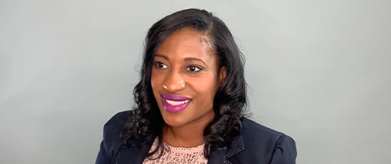 Still Image of Alta Simmons smiling off camera.