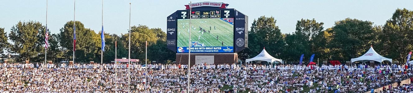 Still image of a very crowded SMU Football Stadium during white out night. On the jumbo screen you see Neighborhood CU Logo.