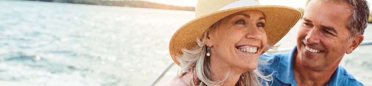 Older couple smiling on a boat