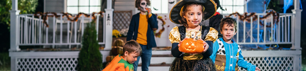 Young children dressed up for Halloween trick-or-treating