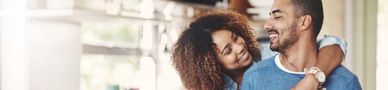 Couple hugging and smiling