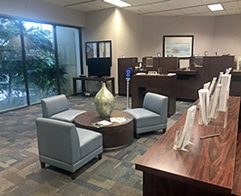 Waiting area with chairs and teller desk