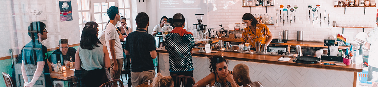 People in line at the counter in a restaurant
