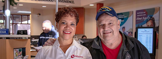 Man and woman standing in bank