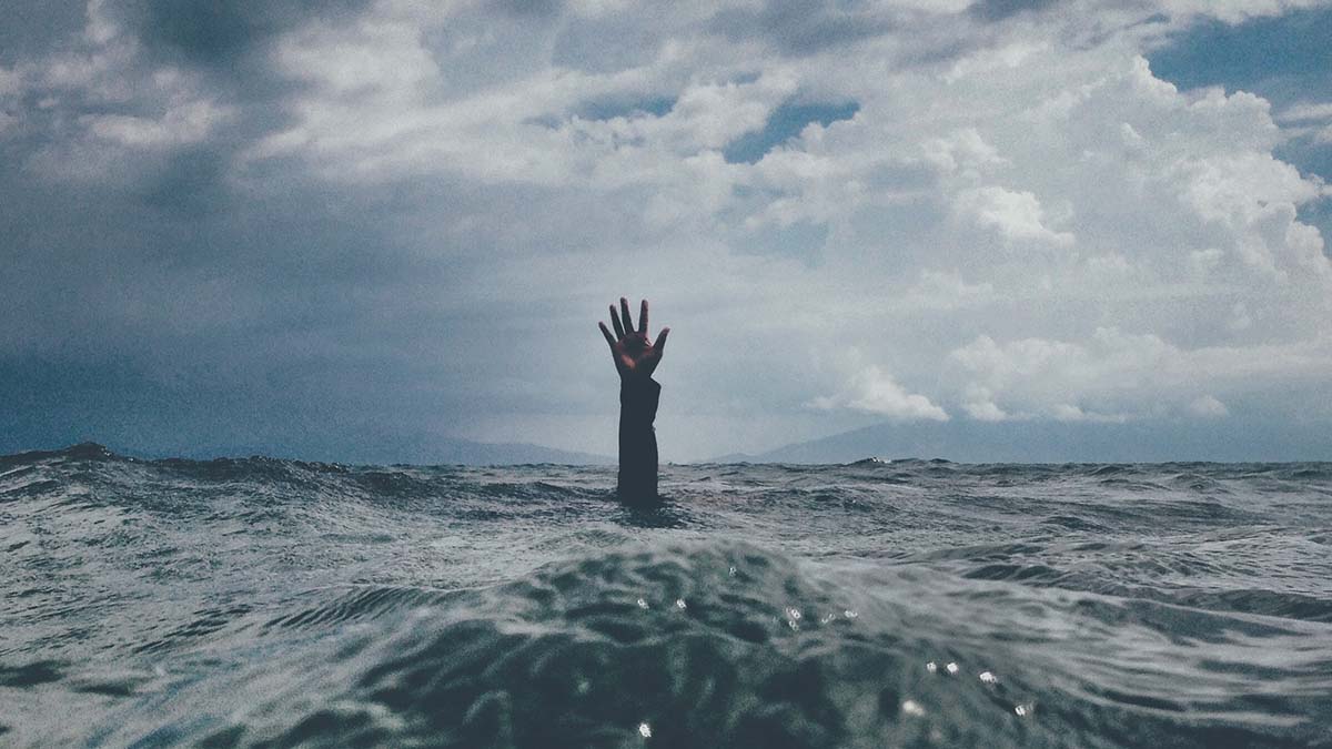 Arm rising above water