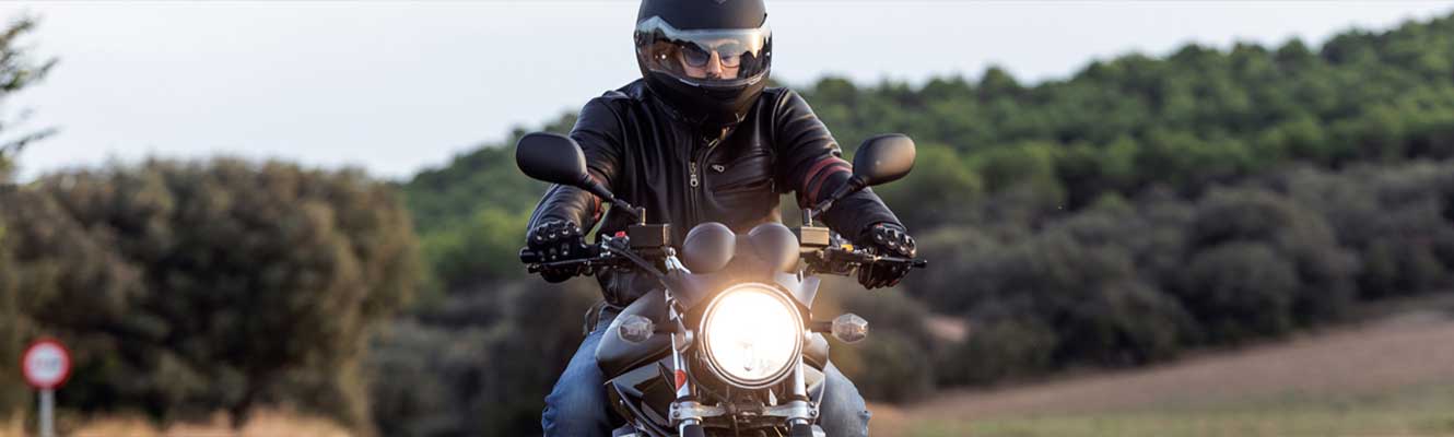 a man on a motorcycle enjoying the open road
