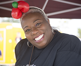 Woman smiling with balloon headband