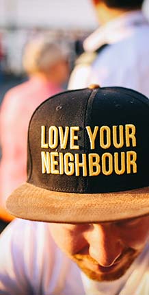 Man wearing black and yellow hat