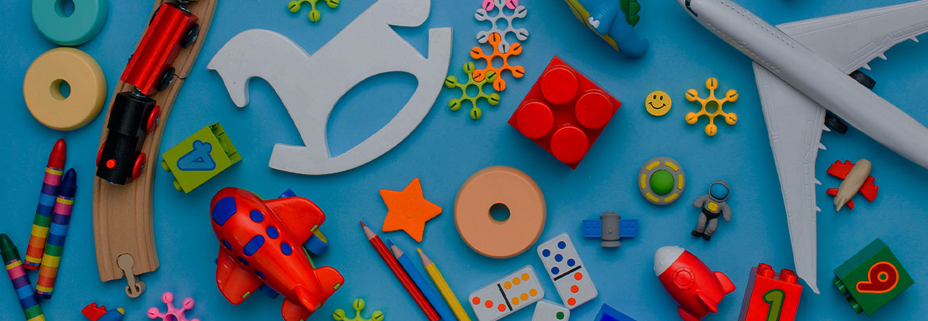 Set of kids toys on blue background. Top view, flat lay.