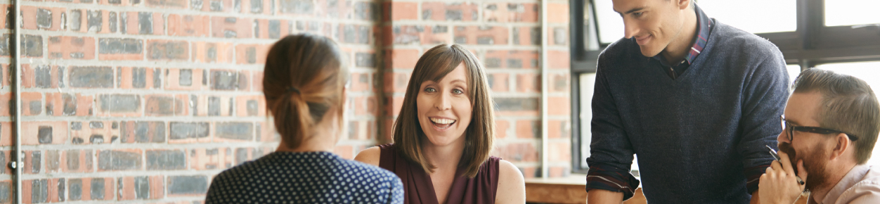 Group of people talking in an office