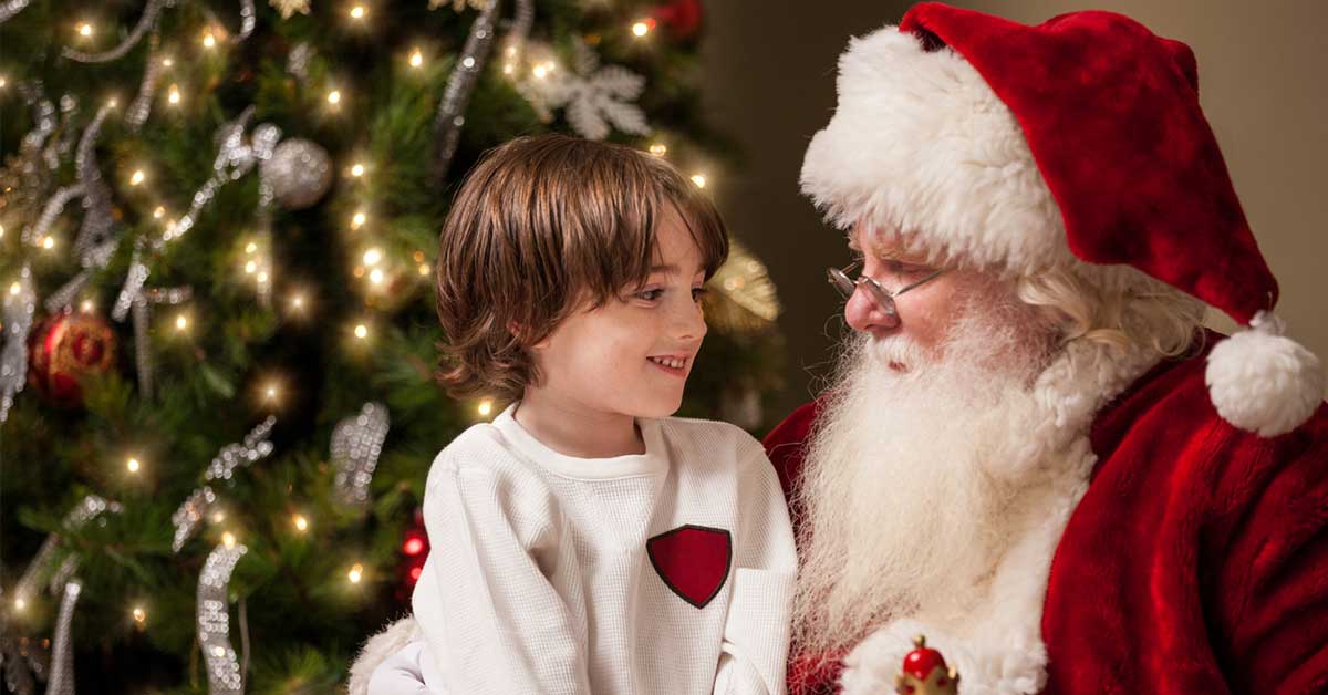 young boy sitting in Santa's lap